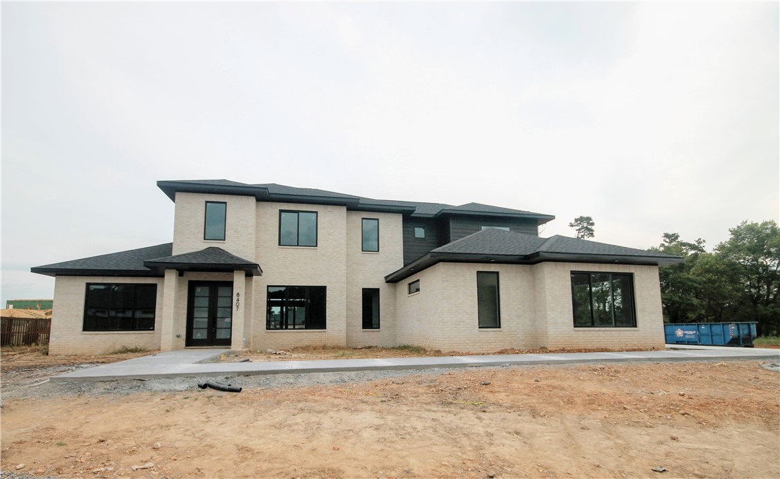 New construction modern masterpiece... Estate home in the highly sought after gated community of Scissortail. 3 car garage, large bedrooms with walk-in closets and their own bathrooms and bonus room with wet bar on the main level! Large open floorplan with TONS of natural light and space to entertain! Large living room with modern tile linear fireplace, floating shelves, 3' plank wood floors and custom stained poplar wood beams. STUNNING bathroom suit with soaking tub with accent stone wall, walk in tile shower and massive walk-in closet with access to the laundry room. Secondary bedroom on the main level with luxurious bathroom. All the features you want including home audio, central vac, Jenn Air appliances with a 6 burner cooktop, griddle, stand alone freezer and refrigerator, trash compactor and double ovens. Enjoy entertaining on the large covered back patio with built in grill!