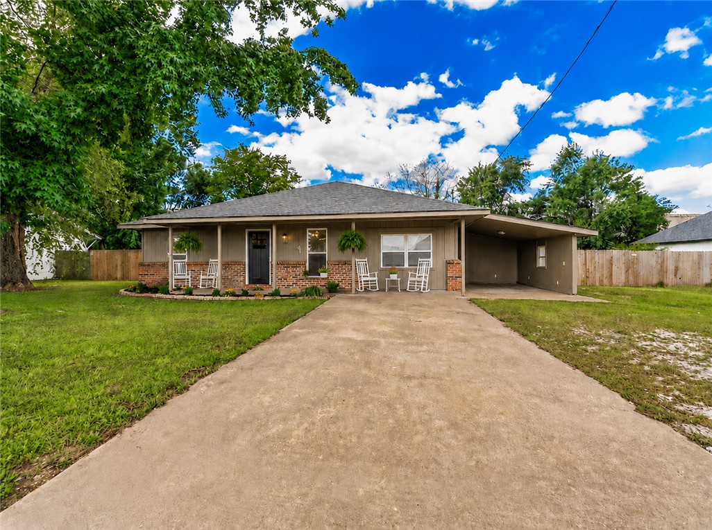 **Ask about preferred lender credit up to $4,000 with acceptable offer and financing.** Tucked away on a large .37-acre lot in Bentonville, this beautifully renovated home offers the rare combination of modern updates, usable outdoor space, and a prime location near everything NWA has to offer. Inside, nearly every detail has been updated - from the kitchen cabinetry, counters, appliances, lighting, paint, trim, and doors to the bathrooms, fixtures, outlets, and hardware - creating a clean, fresh feel throughout. Major improvements like a new roof, insulation, rebuilt covered back porch with can lighting, updated AC lines, and new fencing add peace of mind for years to come. The fully fenced backyard features a 10-ft steel double gate with plenty of room for trailers, hobbies, entertaining, gardening, or simply enjoying extra space. Conveniently located near Downtown Bentonville, Crystal Bridges, the Razorback Greenway, and the new Walmart Home Office.