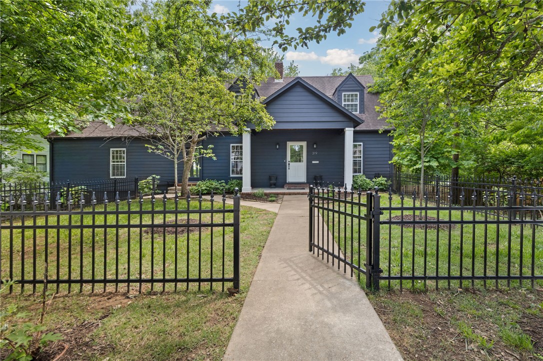 You must see this thoughtfully restored 1949 Fayetteville home zoned for Root Elementary, Holt Middle, and Woodland Jr. High.  A full renovation to this 4-bed, 3-bath home with 4 additional flex rooms includes new HVAC systems, new lighting with LED cans and designer fixtures, all new paint, original white oak floors and new oak added and finished by Wood Floor Gallery. Original windows and brass hardware were lovingly restored, with new vinyl windows and Emtek hardware added as needed. The kitchen received new custom cabinetry, quartz countertops, CLE tile backsplash, a Wolf range with stainless vent hood, and Bosch refrigerator, dishwasher, and microwave. Wallpaper accents add an age-appropriate warmth and character to the large dining room. Renovated baths received new tile, vanities, lighting, plumbing fixtures, and countertops. The front and back yards have been newly fenced-in. Updated landscaping beds include a new professional irrigation system. Native persimmon and pear trees are found on the property.