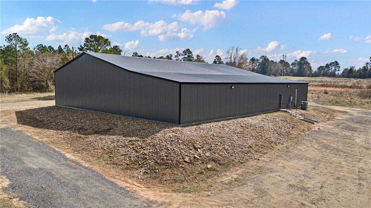Opportunity meets versatility with this impressive 9,600± sq ft commercial event center located on Morgan Road in Dover, Pope County. Currently operating as a sports center, this metal-framed, completely foam-encapsulated facility offers endless potential for a wide range of commercial, recreational, or event-based uses.

Positioned on 0.90± acres, the property features a spacious open layout designed to accommodate large gatherings, athletic activities, training space, entertainment, community events, or future business expansion. Additional features include two bathrooms, an office space, and upstairs storage, adding functionality.

The durable commercial-style construction offers low-maintenance appeal while providing the flexibility to customize the space to fit your vision. Whether you are looking to continue its current use or transform it into something entirely new, this property presents a rare opportunity to invest in a versatile commercial space with excellent potential in a convenient location.