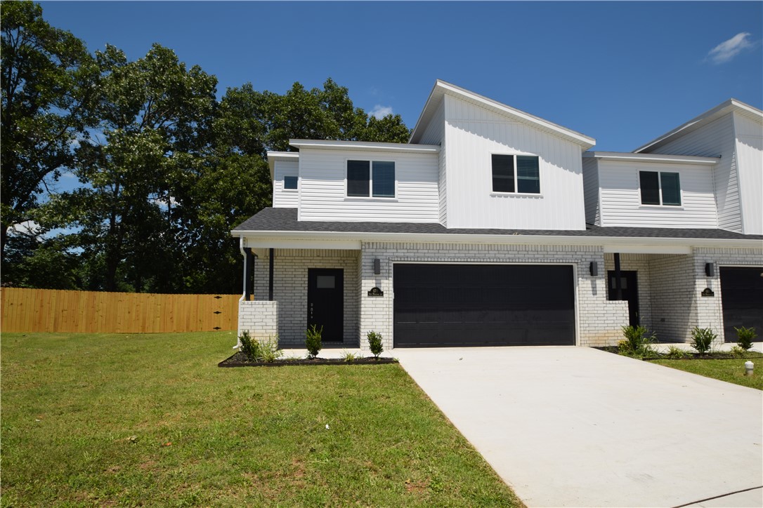 New modern design duplex in the heart of Centerton and close to Schools! This 3 bed 2 1/2 bath plan has an open living concept with tall ceilings and tons of natural light. Kitchen has granite countertops, stainless appliances, a large pantry, and a gas range. Primary bedroom is on the main floor and has walk-in closet. Two bedrooms upstairs with full bath and landing area. Luxury vinyl plank flooring throughout the 1st floor, 2" faux wood blinds, extra storage in the upstairs attic. Property has a private back patio, large yard,  and wood privacy fence.