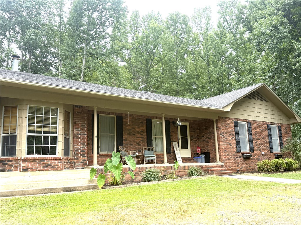 This is the perfect blend of peaceful country living & everyday convenience with this charming home on just under 5 acres. Enjoy the privacy & room to spread out while being only minutes from Interstate 40, downtown Russellville & multiple boat launch ramps for Lake Dardanelle, making it easy to spend days on the water or enjoying everything the River Valley has to offer. With 3 beds, 2 full baths, & two living areas, the flexible floor plan offers endless possibilities, with the second living area easily serving as a 4th bedroom, office, playroom, or bonus space to fit your needs. Complete with a garden area, a charming wet-weather creek crossing your driveway, & plenty of room to enjoy the outdoors. An outbuilding & multiple lean-to sheds provide excellent storage for lawn equipment, recreational gear, or workshop space. Whether you're dreaming of a hobby farm, extra space for outdoor adventures, or simply a quiet place to call home that's still close to town, this property offers the best of both worlds.
