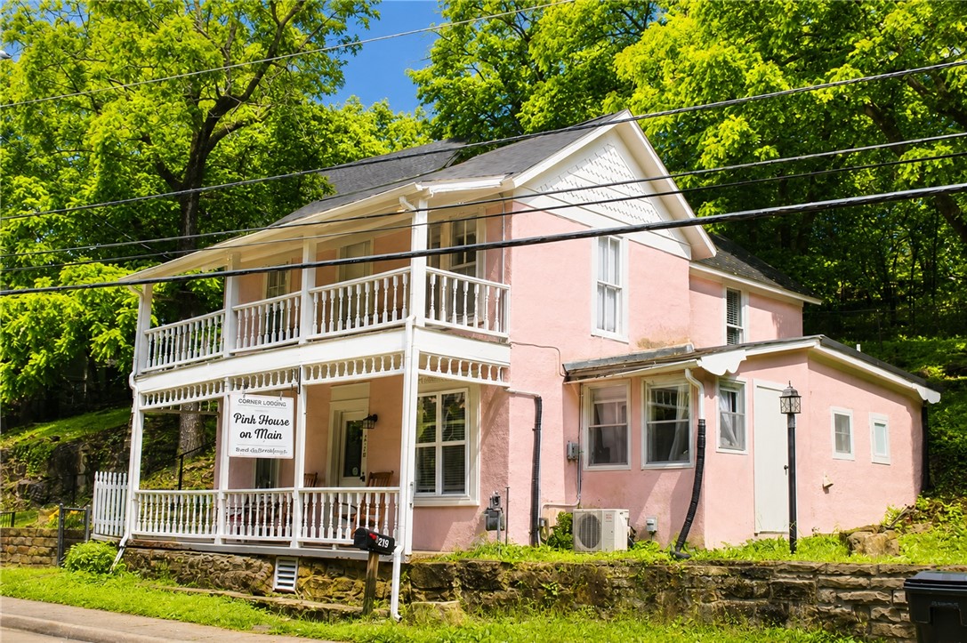 Eureka Springs at it's finest! This charming commercial property is located in downtown Eureka Springs. Within walking distance to shopping, great restaurants, local parades and many wonderful annual events. It is currently being used as an Airbnb. 1 Unit on the main floor and 1 unit upstairs. Each has its own private entrance. Upstairs unit has a BR, kitchen, bathroom, and stackable washer and dryer. Main floor unit has 2 BR's, Kitchen, bathroom, living room and laundry room. It is zoned commercial which makes this property so special. You could live upstairs and have a retail space or office on the main floor. Great options in this adorable home.  Also listed under Residential ML 1348103