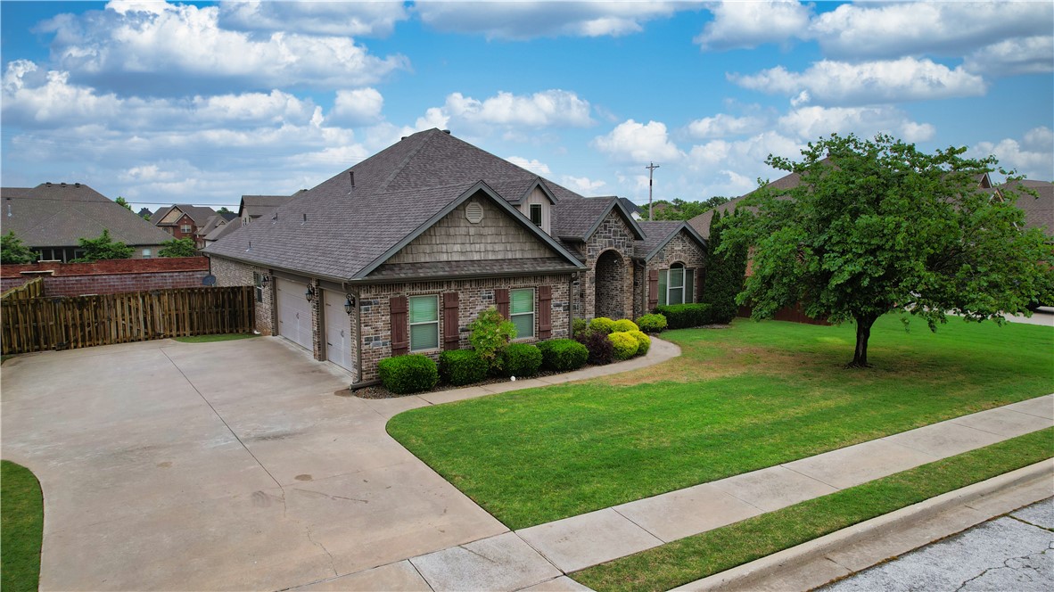 Fantastic Rogers location with Bentonville schools—minutes to I-49, restaurants, shopping, the AMP, & all things NWA. This well-maintained, all-brick 4-bed, 2.5-bath home sits in Liberty Bell South & delivers a move-in-ready 2,180-sq-ft split plan. Enjoy newly installed hardwood in the primary suite & front bedroom, granite countertops, gas fireplace, & spacious en-suite with two walk-in closets. The extra-large 3-car garage adds room for hobbies, a workshop, storage, or a workout zone, plus a tornado shelter for peace of mind. A large covered patio extends your living space outdoors. Recent updates include a new roof with a 25 year warranty on materials, 5 year warranty on workmanship, & transferrable to new owner. Neighborhood perks: community pool, playground & close proximity to Mt. Hebron Park with baseball fields, pickleball, trails, & splash pad. Osage Trail access is just 1.5–2 miles away. A rare find in a prime spot.