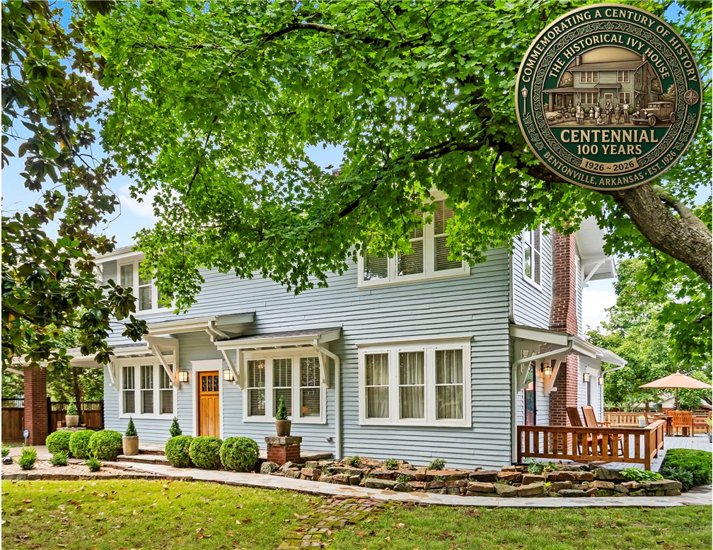 Celebrate the centennial of this exquisitely restored Prairie-Craftsman farmhouse—an iconic piece of Bentonville’s history, once the heart of a 500-acre apple orchard. Every detail honors its 100-year legacy, from original wood floors and high coffered ceilings to wainscoting and restored double-hung windows, seamlessly paired with the confidence of a full-scale renovation including updated plumbing, electrical, HVAC, foundation, and a new roof. The home blends timeless craftsmanship with elevated finishes—soapstone, Carrara marble, and custom black walnut cabinetry by local artisans. The home offers expansive spaces, spa-inspired baths, and a chef’s kitchen. A vaulted coach house provides flexible space for a studio, office, or fitness retreat. Set on a rare one-acre parcel, with a 1200sqft wraparound deck, native stone patios, and lush, park-like gardens—all just minutes from Crystal Bridges, Orchard Park, and the Bentonville Square. A true legacy property, fully restored for modern living.