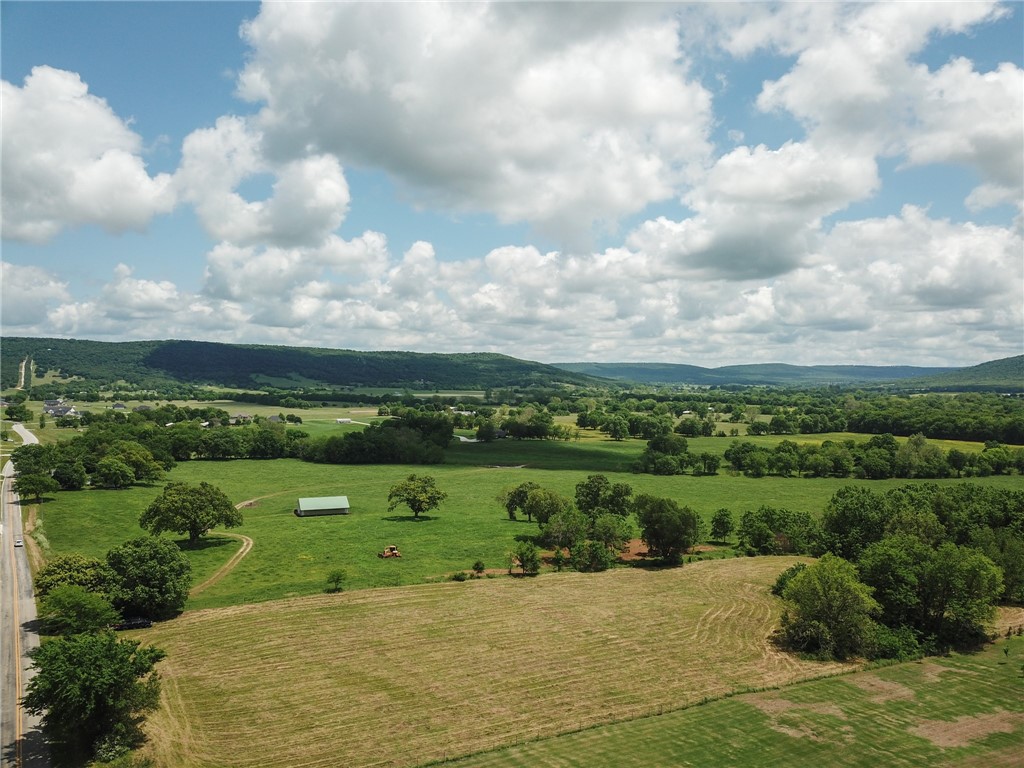 Tract 2- 3.18 acres for sale!! There is absolutely no other listing like this one currently on the market. This piece of property is surrounded by views of the Ozark Mountains and super close to both Farmington and Prairie Grove Schools. Country feel but still keeps you close to town. 

This lot can be purchased separately or with tract 1 as well. Both lots will equal to 6.36 acres if purchased together.
