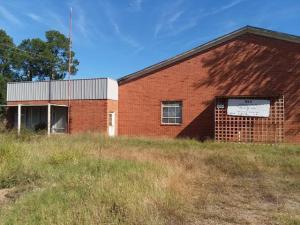 Perfect commercial location with 2 sides of hwy frontage for maximum exposure. Over 20K total sqft.  3 phase power and over 60 items of machinery and equipment conveys with property. (See documents tab for details)