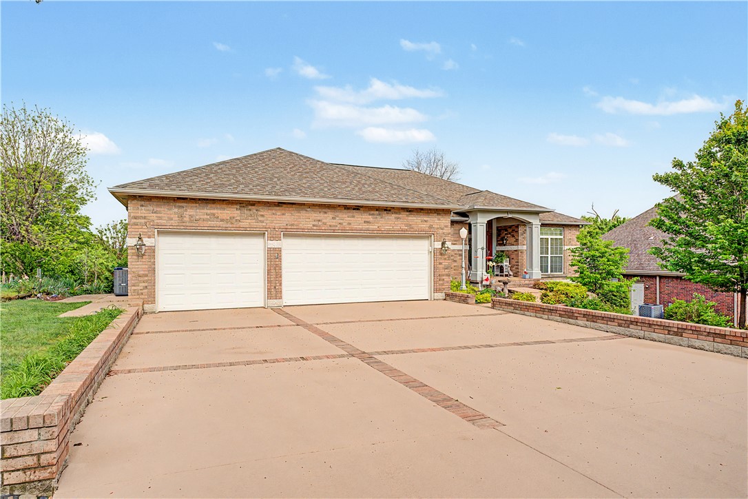 Discover comfort and convenience in this beautifully maintained 3-bedroom, 2-bath all-brick home in Bella Vista. Featuring a spacious and versatile layout, this home offers an inviting sunroom perfect for relaxing year-round, plus an extra-large primary suite that provides a true retreat. The kitchen is equipped with granite countertops and ample workspace for everyday living or entertaining. Washer/Dryer and Refrigerator convey! A rare 3-car garage adds exceptional storage and functionality. Plus there's an additional heated and cooled space in the lower level for storage, workshop, etc.! Enjoy peaceful winter views of Loch Lomond, along with the added efficiency and comfort of a dual furnace system during colder months. Ideally located just minutes from Lakepoint Restaurant and Marina, Scotsdale Golf Course, and some of the area’s best mountain biking trails, this home combines natural beauty with everyday convenience. A fantastic opportunity to enjoy the Bella Vista lifestyle!