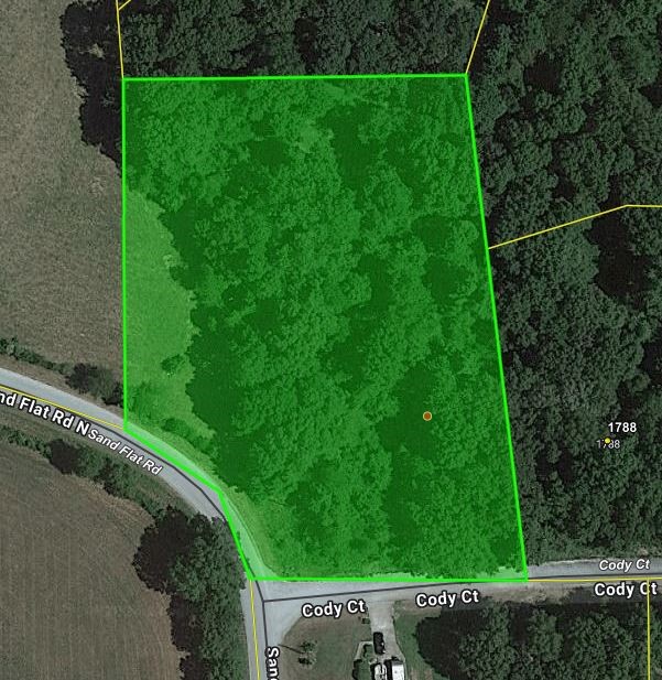 Corner lot, wooded on paved road with water & electric available.  Great building site in established neighborhood.  No mobile homes allowed.