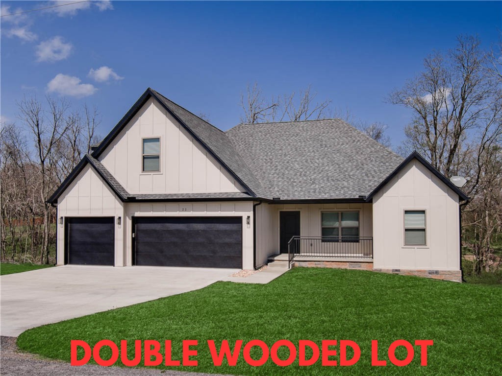 Discover this stunning home set on a spacious .50-acre wooded double lot! Ideally located just down the street from Highlands Golf Course, with quick access to Lake Loch Lomond’s boat launch, trails, and I-49. Built in 2024, this beautiful property features tall ceilings, 4 bedrooms, 2.5 baths, and an oversized bonus room, which offers versatile living options. The 3-car garage provides tons of space for vehicles and storage. Enjoy the large kitchen with custom cabinets and a walk-in pantry! High-end finishes throughout! Step outside to the huge covered deck, perfect for entertaining family and friends in a serene setting. Pool table, wall rack, and chairs convey if desired. Plus, take advantage of $3,000 in buyer's closing costs, courtesy of the seller's preferred lender. Don’t miss your chance to own this exceptional home!