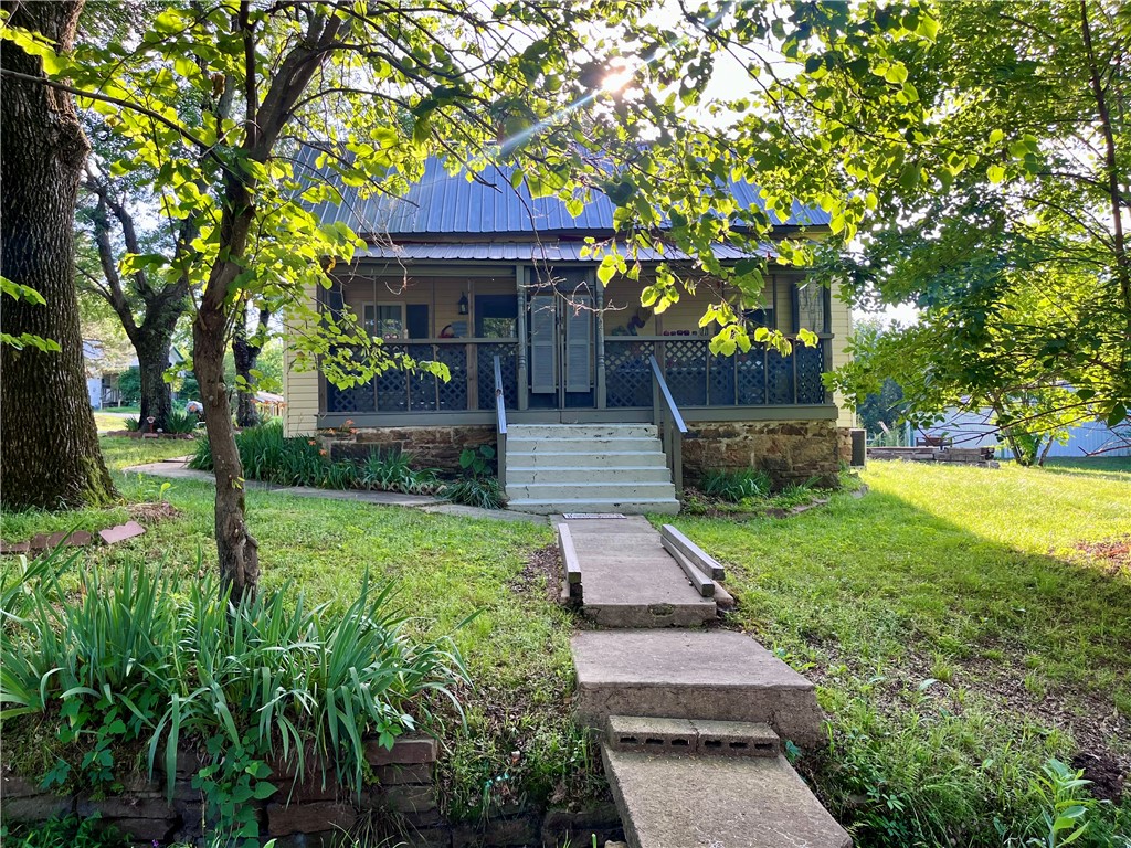 Nestled on a 0.73-acre lot in Arkansas wine country, 1421 Hendrix Street is a prime investment opportunity. Fully renovated with extensive updates throughout, including foundation improvements, a home addition, and numerous other renovations, this property offers both character and peace of mind. The generous acreage offers privacy and room to expand with a workshop or garage. For investors eyeing vacation rental potential, this location is ideal, sitting minutes from four historic wineries: Post Familie, Wiederkehr, Chateau Aux Arc, and Mount Bethel. Featuring a native stone foundation, metal roof, and a screened front porch with wood ceilings, this character-rich home is perfect to attract tourists seeking a wine country getaway or to serve as a primary residence with room to grow!