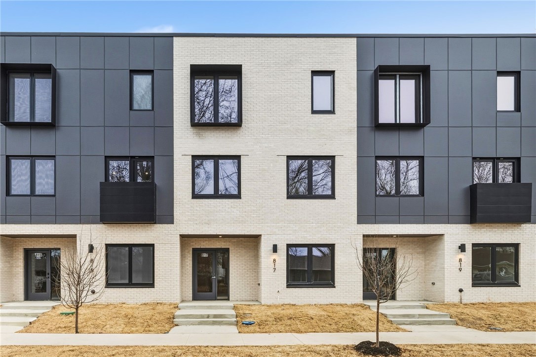 Do you want to walk to work?  Do you like live music?  Experience the very best of downtown Bentonville living at LIGHTBOX. Perfectly positioned in the new heart of Bentonville, these industrial-inspired townhomes put you steps from the Walmart Home Office, 8th St. Market, and The Momentary.  
The "Soft Light" floor plan is an architectural standout, featuring a clerestory design that harvests natural light from above. Inside, a sculptural floating steel staircase serves as a functional piece of art, grounding the home’s bold, modern character. This expansive residence offers four large bedrooms and thoughtfully designed baths, plus a dedicated office and a top-floor flex lounge for versatility.
The primary retreat is a sanctuary of its own,  a European-style wet room, floating vanity, and dual closets. From the oak-clad kitchen with pro-grade induction cooking to the community fire pit for evening social hours, Lightbox isn’t just a home—it’s a lifestyle statement.