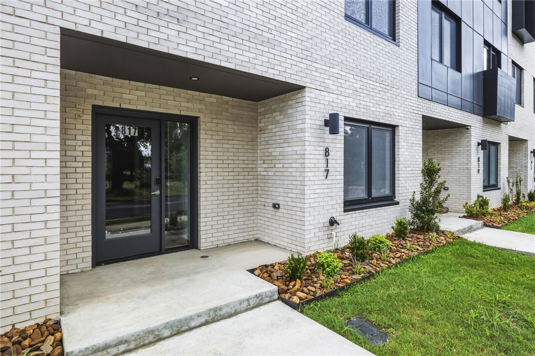 Do you want to walk to work?  Do you like live music?  Experience the very best of downtown Bentonville living at LIGHTBOX. Perfectly positioned in the new heart of Bentonville, these industrial-inspired townhomes put you steps from the Walmart Home Office, 8th St. Market, and The Momentary.  
The "Soft Light" floor plan is an architectural standout, featuring a clerestory design that harvests natural light from above. Inside, a sculptural floating steel staircase serves as a functional piece of art, grounding the home’s bold, modern character. This expansive residence offers four large bedrooms and thoughtfully designed baths, plus a dedicated office and a top-floor flex lounge for versatility.
The primary retreat is a sanctuary of its own,  a European-style wet room, floating vanity, and dual closets. From the oak-clad kitchen with pro-grade induction cooking to the community fire pit for evening social hours, Lightbox isn’t just a home—it’s a lifestyle statement.