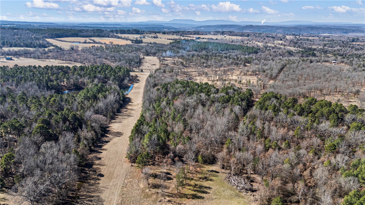 Discover a rare opportunity to own an one-acre lot in a unique and evolving rural setting, perfectly positioned next to an active airstrip. This property offers a distinctive blend of privacy, open space, and aviation access: ideal for enthusiasts, or anyone seeking something out of the ordinary. Imagine the convenience and excitement of fly-in access right to your doorstep, making travel seamless and truly one-of-a-kind. The surrounding area is already generating interest with planned development for a community campground, scenic lookout tower, and additional outdoor oriented amenities designed to enhance the natural landscape and create a destination atmosphere.  The rural setting delivers peaceful surroundings, wide open skies, and a strong connection to nature while the nearby airstrip and upcoming community features add both value and appeal. Opportunities like this are increasingly rare: own a piece of land where lifestyle, recreation, and potential growth all take flight.