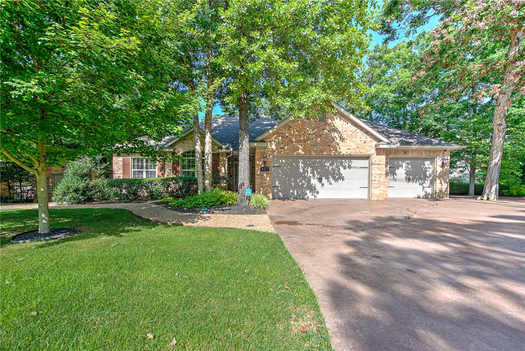 Experience the beauty of everyday living in this impeccably maintained home, where gorgeous landscaping, mature trees, and a peaceful wooded setting create the perfect place to relax and recharge. Enjoy your morning coffee or evening gatherings on the expansive deck overlooking nature, where every season brings a new view. Inside, you'll appreciate the warm hardwood floors, granite countertops, custom wood cabinetry, and inviting living room with a cozy fireplace that creates the perfect place to unwind. The rare 3-car garage and additional workshop/storage provide plenty of room for vehicles, hobbies, and outdoor gear. Just minutes from Bella Vista's world-class trails, lakes, golf courses, parks, and the Metfield Clubhouse, this move-in-ready home offers the lifestyle you've been searching for.