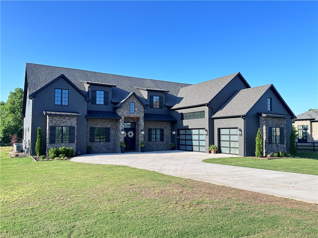 Welcome to your dream home in the heart of convenience and luxury living! This stunning property, built by Saphire Homes in 2021, offers an unparalleled combination of space, elegance, and contemporary design. Situated on over an acre lot, this 4261 square foot residence boasts designer detail and a prime location. Upon entering, you'll be greeted by an expansive open floor plan featuring tall ceilings, views to a backyard oasis, and an inviting atmosphere that's perfect for both relaxation and entertainment. Embrace indoor/outdoor living with expansive panoramic doors that reveal a newly installed gunite pool, outdoor fireplace and greenspace. 

The main floor hosts the primary suite, guest suite, office with built-in shelving, and a kitchen/living/dining room area, all seamlessly blending style and functionality. Three additional bedrooms w/ bathrooms and media room upstairs.

Located minutes from schools, the Bentonville Community Center, Pinnacle Promenade, shopping, restaurants, and entertainment.