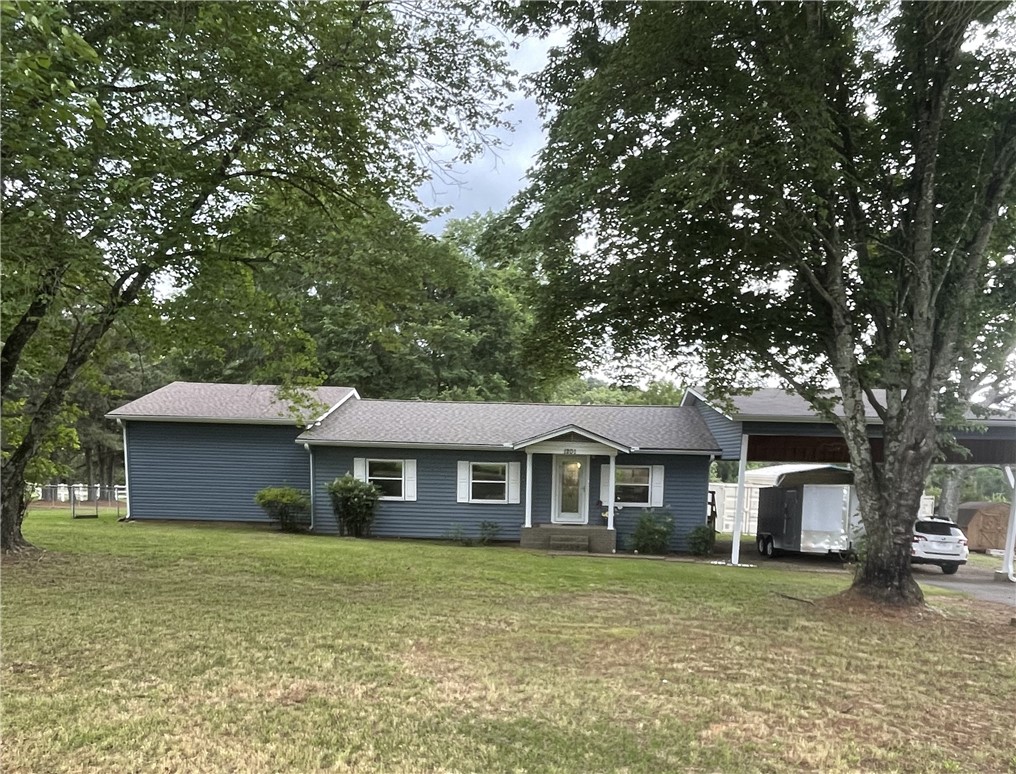 Lovely home in a beautiful, serene location! Lots of space to spread out and have the mini-farm you've always wanted! 3.55 manicured acres, partly wooded, with a little stream to sit beside and cast all your cares away! Enjoy the sights and sounds of nature while being mere minutes from U of O and downtown. You can see deer every day, baby fawns sometimes, an occasional bobcat, and of course squirrels, rabbits, and raccoons! Big deck and patio perfect for entertaining friends. Established garden areas with outside spigots and a water well! Inside, an EF5 tornado safe room for your peace of mind (heated and cooled); walk-in pantry; quartz counters; recently remodeled kitchen with top-of-the-line dishwasher and gas range; recently remodeled bathrooms; excellent wood laminate flooring throughout; new whole-house tankless water heater~endless hot showers; jacuzzi tub for soaking and a walk-in tile shower! What are you waiting for? Call today for your private showing! Two pods for storage; carport has a shop in back.