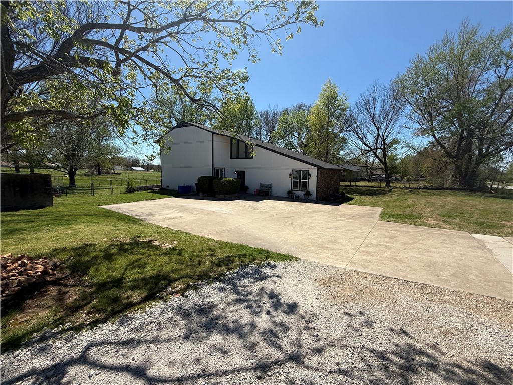 This stunning 2,931+/- Sq Ft 1 acre estate perfectly blends farmhouse charm with modern luxury. The open-concept heart of the home features wooden ceiling across the living room and kitchen, complemented by a gorgeous custom backsplash and a grand wooden staircase. Designed for ultimate comfort and flexibility, the layout boasts two master bedrooms and two laundry rooms. The primary retreat is a true sanctuary, featuring a cozy electric fireplace and a spa-inspired ensuite. This massive walk-in shower room includes a freestanding tub and a toilet equipped with a bidet. With tasteful interior upgrades throughout and a huge yard, this property offers the space and sophistication you’ve been searching for.