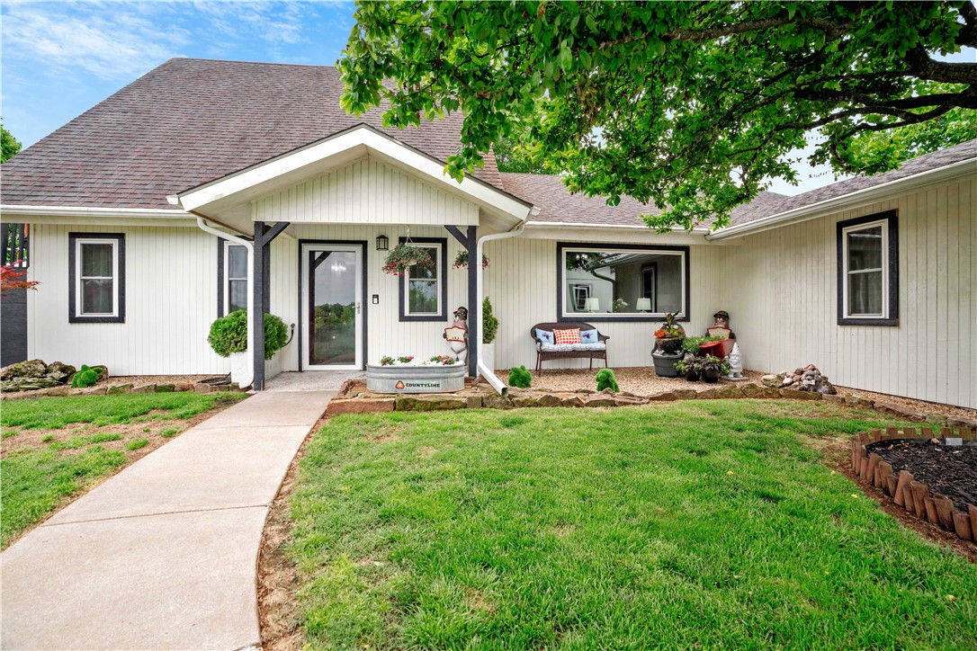 One-Owner home, with Million Dollar Views.  This is a custom built home that sits atop a beautiful hillside in West Fayetteville.  This 4-bedroom home gives you the sense you are in the country but the closeness of the City, it sits 10 minutes from the UofA.  It has a custom-built dog bed area under the stairs, with updates throughout the home.  It has a 3-car detached garage, with and workshop also available.  You can sit on the deck and enjoy the views while you have your cup of coffee.  The property is on the county line, with the front fence being the city limits.
