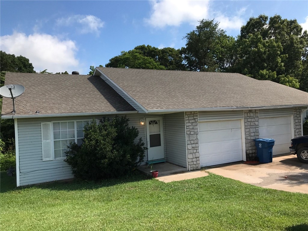 Great investment property in Gravette! Newly updated duplex with leases for both units in place. Unit A recently updated. 2 bedrooms, 2 baths, 1 car garage. Same plan on each side. Huge laundry/storage room in garage. Unit B has wood-look laminate floors all the way thru it.