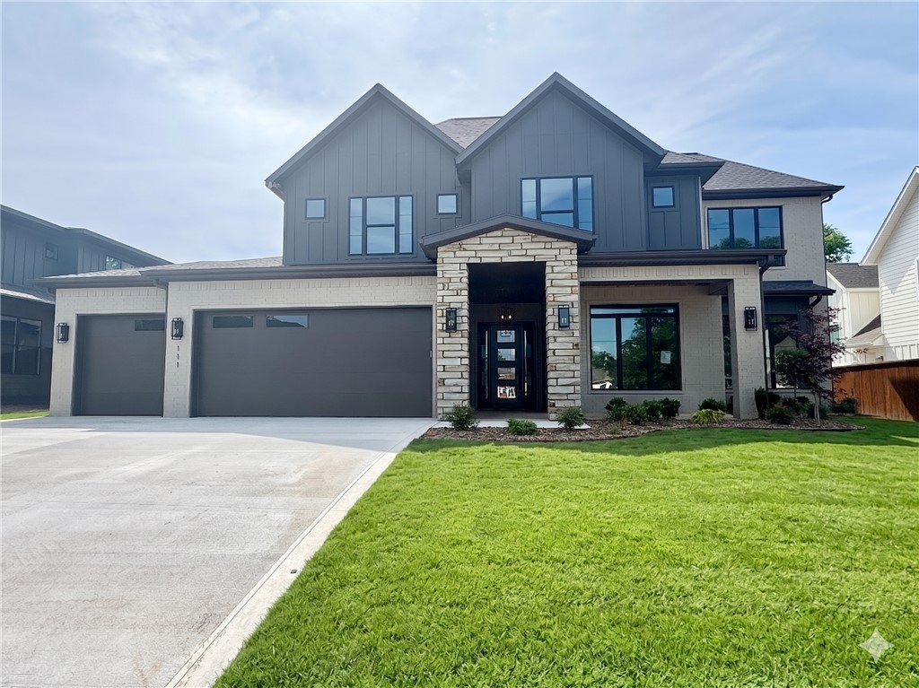 Located in the perfect location w/ easy access to Coler Mountain Bike Preserve trails, schools, downtown Bentonville & more. The heart of this haven is undoubtedly the chef's kitchen, sprawling island, vegetable sink, 5-burner/double oven gas range, quartz counters/backsplash, walk in pantry, and custom stained walnut cabinets. Living room centers around stunning tile gas fireplace, enveloped by oversized windows that bathe the space in light. Adjacent, the dedicated dining area is positioned for a seamless flow. Retreat to the primary suite, where oversized windows invite in sunlight & spa-inspired bath with a walk-in tile shower featuring double showerheads, soaking tub, double sinks, smart mirrors & walk-in closet with direct access to the laundry room. Study with French doors and beams and secondary suite on the main level. Upstairs reveals a generous bonus room with a wet bar and two secondary bedrooms. Enjoy the oversized covered patio overlooking the fenced backyard. $3,000 if you use the preferred Lenders