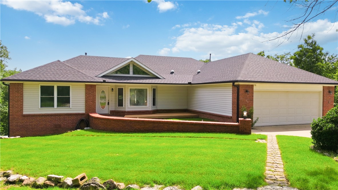 Tucked away on a private cul-de-sac, this home offers a rare blend of privacy, flexibility, and unbeatable location. Just moments from the renowned Back 40 trail system, outdoor enthusiasts will love quick access to Zone 4, a scenic blue trail. What truly sets this property apart is the adjoining lot, opening endless possibilities. Build a second home, create the garden oasis you've always wanted, or enjoy extra space for RV parking, just as the current owner has for years. Inside, thoughtful updates to the kitchen and primary bath complement the walk-out basement, transformed into ideal guest quarters with their own bedroom, bathroom, and living area. A dedicated workshop with utility sink, generous storage, and an expansive composite deck completes the package. Homes with this much privacy, land, versatility, and direct trail access are rare. Experience adventure, comfort, and room to grow at 11 McManigal Lane.