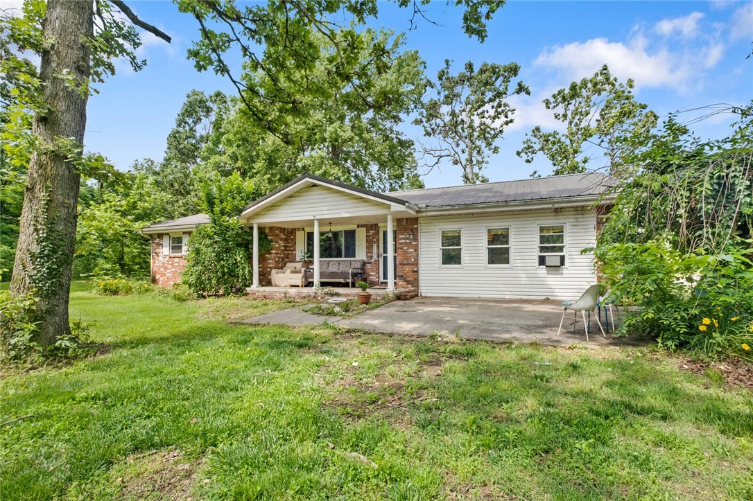 Great opportunity to own a home close to town but still in the country! 3/2 with a garage which has been previously converted to living space (could be converted back)…with this space it can be considered 4 bedroom. Brick home with porches to enjoy coffee in the morning! This property comes with 5 ac mol ~ there will be possible restrictions on yard birds not being allowed due to commercial growers in close proximity. There will be a shared driveway with seller to access additional property. There are laying hens in the back of the property. More options can be discussed on land, but currently marketed as 5 acres mol and a new survey will be required. Portion of a larger tract. Great space, maintenance free flooring. Ready for a family to love and create memories! Poultry drive will be moved post-closing. Small tiny building (set up to live in) will also convey.