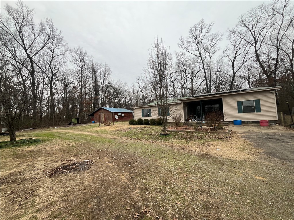 3 Bedroom/1.5 Bath Home PLUS an Extra Bonus Room that could be used as a 4th Bedroom or an office space (with another half bath), all on One Acre. This house also has a Large Den with a Fireplace and a Large Pantry off the Kitchen.  Come Check it out!