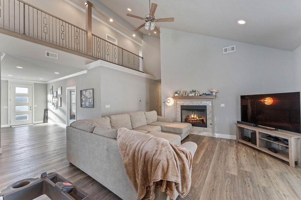 Modern Luxury Steps from the New Walmart Home Office for the ultimate Bentonville lifestyle at 1305 NE 2nd St. Perfectly positioned for work and play, this 2019-built home is walkable to the new Walmart Home Office and just minutes from the Bentonville Square, Crystal Bridges, and top-tier trail systems. The heart of the home features a large kitchen with Cambria Quartz, waterfall islands, a Frigidaire Gallery appliance suite, and a seamless open floor plan. With 5 bedrooms plus a private office and 3.5 baths, there is ample space for remote work and guests. Garage features Two Pro Slat wall organization systems, EV-Ready setup with a Tesla Wall Connector & ample space for bikes. This home has been meticulously maintained with recent high-value upgrades, including a new roof, gutters, garage door, & vinyl-foam siding. Enjoy "smart" living with a whole-home water softener, reverse osmosis drinking water, and a cozy Kozy Heat Sassafras log set fireplace. Outdoor Living includes private balcony & 165 sq ft patio.