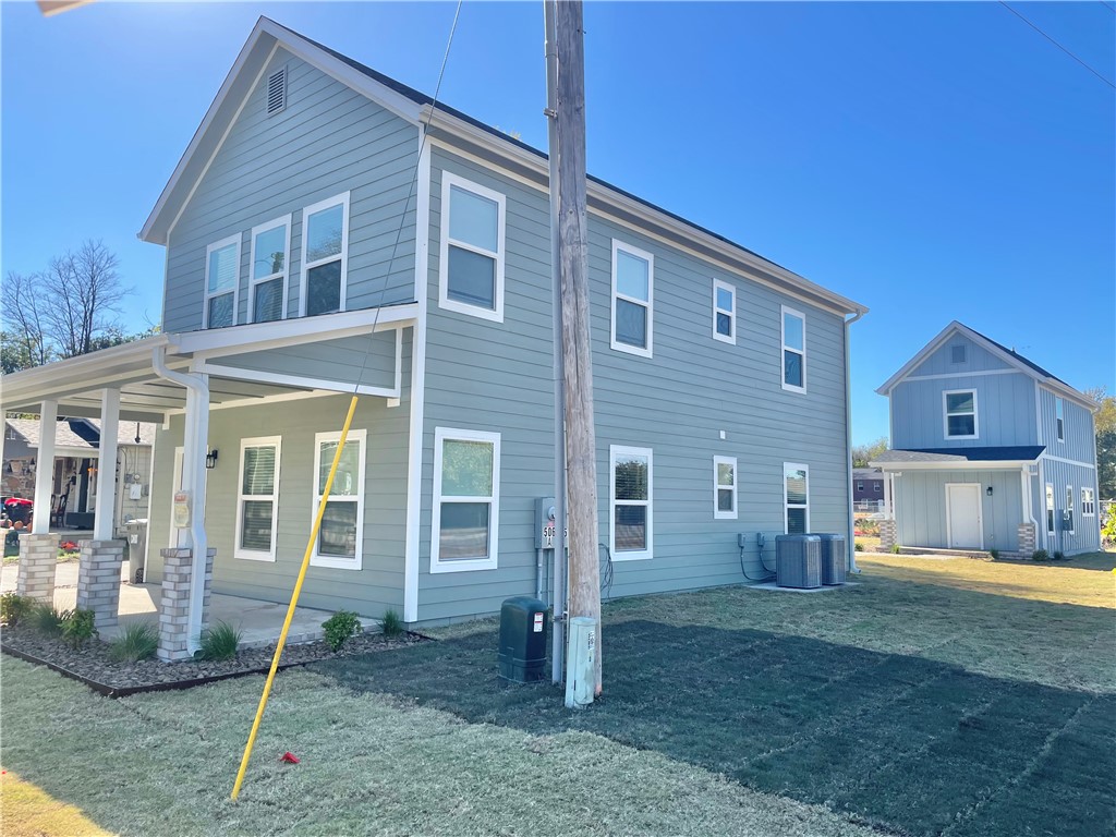 Downtown Springdale stacked duplex with 2 parking spaces. Razorback Greenway trail is in front yard, and home is within close proximity of Luther George Park. This 2 bedroom, 2nd floor unit comes with all new appliances including a refrigerator and a stacked washer and dryer. This brand new home has granite countertops, LVP floors, a nice front porch, and a large shared yard for activities. The construction project to the West is for new townhomes.