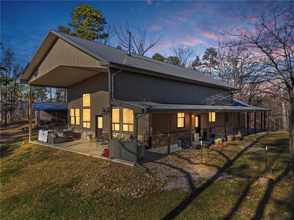 Ozark Vista 40 acres with 2600 sf Barndominium just completed after 4 years.  Wood finishes are cut and crafted trees from this property.  Don't see many Barndos with this attention to detail.  Two ridge top parcels to explore for creeks,bluffs,caves,springs, etc.  Open large loft with bath and large finished closet serves as a guest area or 3rd bedroom suite with office area.  Large main bedroom suite with nice walkin shower and tub, not to mention sauna in large walkin closet off bath.  Main level guest room with guest bath just across the hallway. Wonderful custom kitchen, complete with walkin pantry.  Great Room has a grand piano (neg separately) and a free standing woodburning fireplace for cozy winter days.  High ceilings yet still very energy efficent electric bills.  Separate 18x18 metal building with overhead door for your fishing boat or UTV with 8x18 extended roof on one side.  Garage is 26x30 and has lots of room for workshop and vehicles. Breathtaking sunrises and sunsets are the norm from the patio.