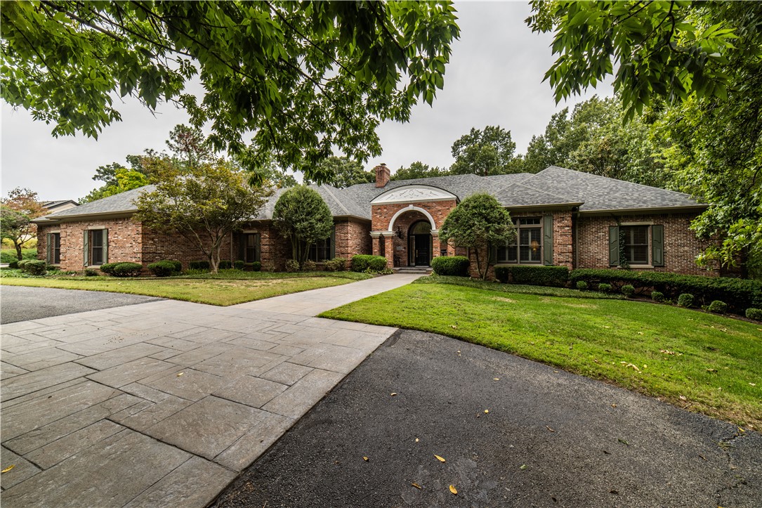 Experience timeless elegance at 309 Lake Road — a truly exceptional custom estate nestled on 3.89 wooded acres overlooking the serene beauty of Lake Fayetteville Park. Designed for those who appreciate refined craftsmanship and privacy, this traditional masterpiece offers 4 bedrooms, 3.5 baths, and thoughtful architectural details throughout.

Enjoy winter lake views, easy access to the Greenway Trail system, and a heated pool perfect for year-round relaxation. Every inch of this residence exudes sophistication — from its elegant finishes to the seamless flow of its inviting interiors.

Tucked away in South Springdale, just east of Springdale Country Club, this home offers the perfect blend of tranquility, convenience, and prestige.

Luxury. Location. Lifestyle. Welcome home to 309 Lake Road.