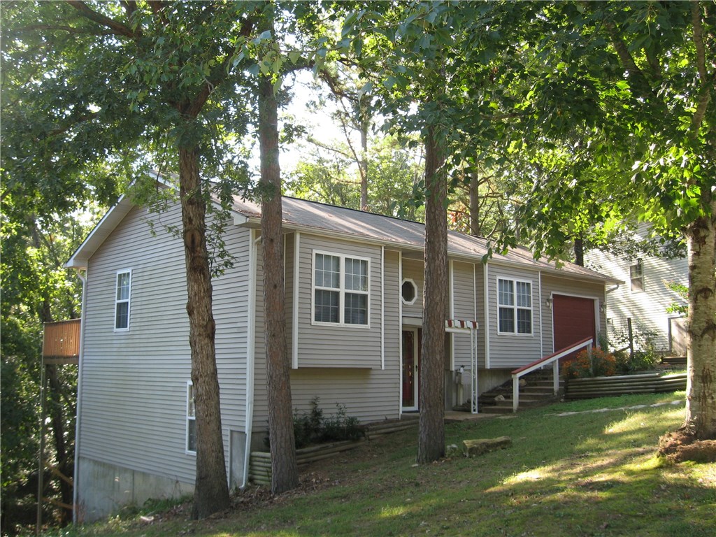 Well maintained 1774 sq ft 2 level, 3BD/2BA in quiet neighborhood in town, all appliances included, refrigerator, range, dishwasher, stacked washer & dryer, new roof in may 2015, new energy efficient AC unit in 2014, new AC-coil in 2013, sun setter retractable awning on upper deck, walk-in handi-cap tub, new faucets, new carpet main Level, new interior paint throughout, tile floors, some granite vanity tops, wide door ways, entry way, termite policy, wooded view on back deck, flower bed in front.