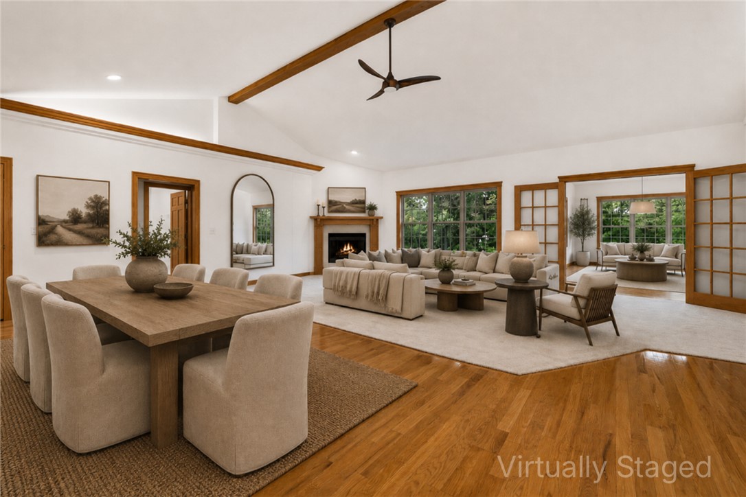 Stunning lake-living lifestyle retreat situated on nearly a half acre park-like lot.  This home has been refreshed with new carpet throughout and all exterior doors have been newly painted.  Located on a quiet cut-de-sac with easy access to Lake Lock Lomond, you are steps away from a public boat launch, world-class hiking and biking trails.  The open floor plan is bathed in natural light, featuring a sunroom with large windows that capture year-round partial lake views.  The main level offers a split bedroom layout, while the finished walk-out basement presents and incredible opportunity for an AirBnB or multi-generational living, complete with a full second kitchen and a private entrance which is only accessible from outside the home.  Outdoor living is a dream here, with 4 spacious decks, a gas fire pit, over-sized 3 car garage, a 245 sq ft heated and cooled and massive unfinished storage space.  From the modern interior updates to the incredible income potential, this home offers the best of Bella Vista living.