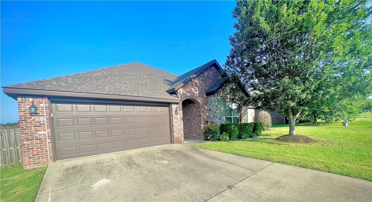 Welcome home to 108 Peyton St. in the highly desirable Weatherton Subdivision! Conveniently located in the heart of Northwest Arkansas, this home is within the Rogers School District and just minutes from JB Hunt, Walmart, Tyson offices, parks, shopping, trails, and easy access to I-49. This thoughtfully designed home features an open-concept layout with wood and tile flooring throughout the main living areas and comfortable carpet in the bedrooms. The spacious kitchen offers granite countertops, bar seating, and seamless flow into the dining and living spaces—perfect for everyday living and entertaining. Enjoy cozy evenings by the fireplace under a vaulted ceiling, while staying connected to the conversation from the kitchen and dining room. Step outside to a large fenced backyard with a deck, great for hosting gatherings, relaxing evenings, or outdoor fun. Residents of Weatherton also enjoy outstanding neighborhood amenities, including a community pool and playground.
