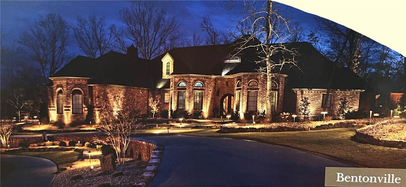 With 22' vaulted ceilings, beautifully distressed hardwood floors and a backyard built for entertaining, this home is truly a stunner! Enjoy taking your elevator down to the finished basement to the fully equipped wet bar and media/theater area. This 5 bedroom, 4.5 bath home has a fabulous master suite w/double walk-in closets, luxurious bathtub, walk-in shower and indoor hot tub. Located less than a mile from Crystal Bridges and a few minutes from everything downtown Bentonville has to offer!