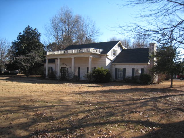 A one-owner, custom built Colonial brick home. 9 Foot ceilings. 5 Large bedrooms, all have adjoining bathrooms, good closet space & built-ins. Spacious foyer w/spiral staircase + a second staircase from family/kitchen area.  9x11 Craft room. Utility w/built-in ironing board & desk, sink. Kitchen: built-in double oven & range top, pantry, French doors that lead to a charming glass sun room w/brick floor. Large lot 0.4 Acre.  Wonderful yard...superb grass. Walk to park/swimming pool, library, & high school.