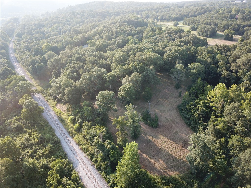 Who says you can’t have it all. This 15.64 acres has woods, field, pond and even a river view with more clearing. Over 700’ of White River frontage and use of the private boat launch and club house. Several options for a home site. Paved roads make this even more desirable and only 20 minutes to town.