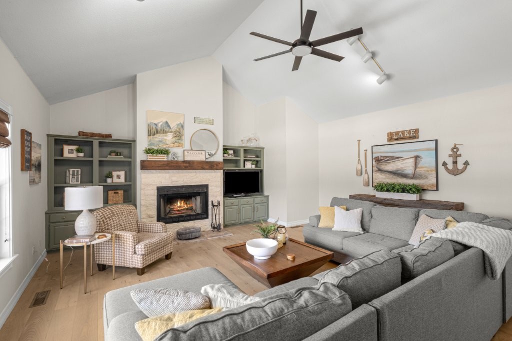 Lake area beauty! Fully remodeled with a large living room, spacious kitchen and oversized deck. Flexible 4–5-bedroom layout with office space and private tree lined backyard. Bonus! Adjacent lot included with a playground, offering extra space for recreation and entertaining.