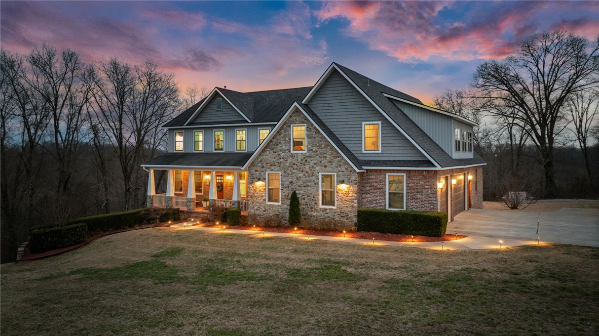 Welcome to 11010 Meadow Lark Rd in Rogers, Arkansas — a custom-built home tucked at the end of a quiet cul-de-sac on 2.53 acres with a peaceful wooded backdrop. Conveniently located just 10 minutes from downtown Rogers and less than 17 minutes to the new Walmart Home Office, this property offers the ideal blend of privacy and accessibility.
Spanning three levels 5180 sq ft, this thoughtfully designed home features 6 bedrooms, 5.5 bathrooms, two living areas, and two kitchens, creating an ideal setup for multigenerational living, guests, or flexible entertaining spaces. Quality craftsmanship is evident throughout, along with valuable upgrades including a safe room, partial backup generator, and energy-efficient solar panels that help keep utility costs low.
With timeless finishes, expansive living spaces, and a serene natural setting, this property offers space, functionality, and modern efficiency — a rare opportunity to enjoy country living while remaining close to everything Northwest Arkansas has to offer.