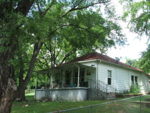 Older home on several lots constituting approx. 1.7 acres in Pyatt. CH&A. Shed, carport, barn. Fenced pasture. Large Trees. Pretty yard. Check it out!