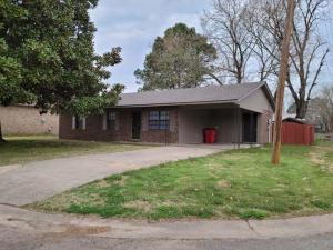 Newly remodeled!!!  3 bedroom 1.5 bath brick ranch style home, close to middle and high school. This home sits on a corner lot with a fenced backyard and a carport. Roof is new!