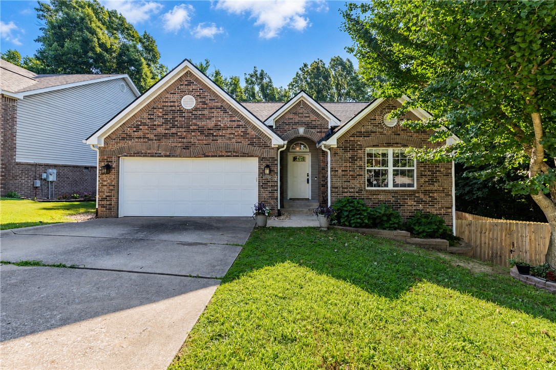 Sitting in the heart of the Slaughter Pen trail system, with Angus Chute viewable from the porch and accessible just 50 feet away this home is a mountain bikers dream while being less than 2 miles from downtown Bentonville square. The home is nestled in the trees in the coveted Northaven Hills subdivision. The home has a great layout with inviting dining area off the kitchen/entry with loads of counter and cabinet space. Large living room with 3 beds and 2 bath on the main level. There are 1511 square feet on the first floor and 535 square feet in the apartment downstairs ideal for those buyers seeking a ready made short term rental, multi generational living situation, or mother in law suite.   The deck is a great place to enjoy the beauty and nature that Bentonville provides. Roof replaced in 2022.