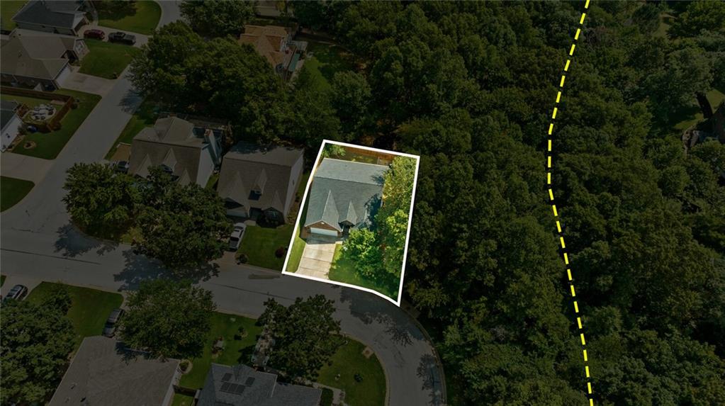 Sitting in the heart of the Slaughter Pen trail system, with Angus Chute viewable from the porch and accessible just 50 feet away this home is a mountain bikers dream while being less than 2 miles from downtown Bentonville square. The home is nestled in the trees in the coveted Northaven Hills subdivision. The home has a great layout with inviting dining area off the kitchen/entry with loads of counter and cabinet space. Large living room with 3 beds and 2 bath on the main level. There are 1511 square feet on the first floor and 535 square feet in the apartment downstairs ideal for those buyers seeking a ready made short term rental, multi generational living situation, or mother in law suite.   The deck is a great place to enjoy the beauty and nature that Bentonville provides. Roof replaced in 2022.
