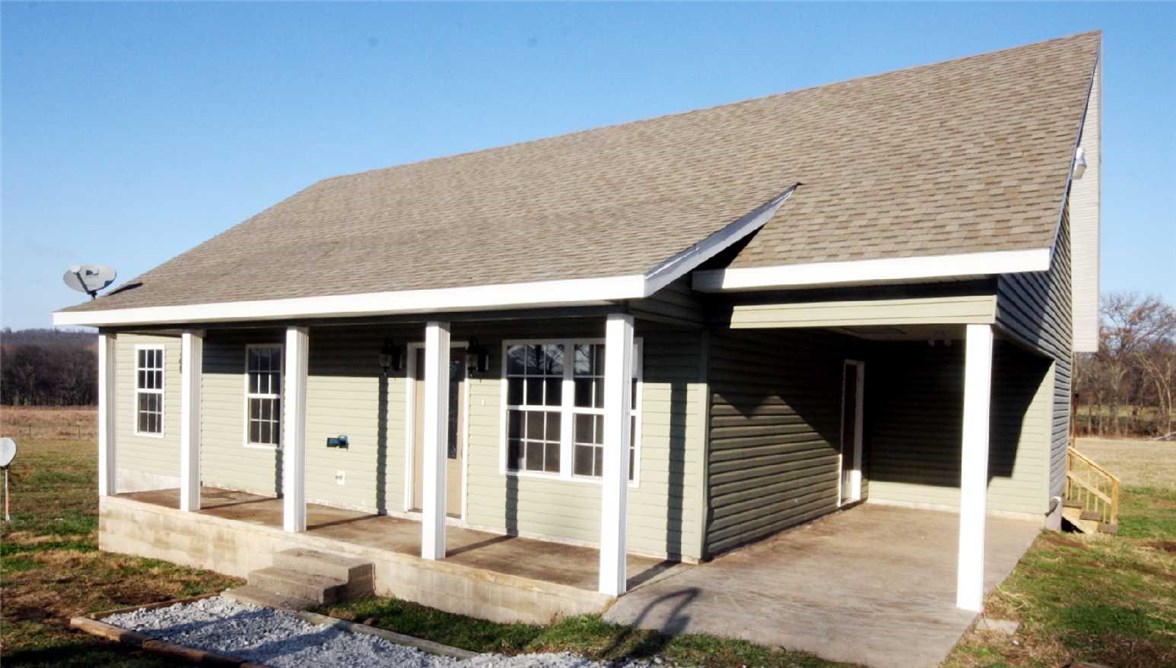 Great newer home in the country with 1.48 acres of mostly level open land.  Home has 4 bedrooms with 3 downstairs (including master).  HUGE 4th bedroom (or bonus room) upstairs with private full bath, built in bookshelves & drawers +private balcony.  Living room has vaulted ceilings.  All floors downstairs are easy care stained concrete.  Natural stained knotty alder cabinets give the kitchen that rustic look.  Concrete countertops will last forever. SELLER WILL PAY UP TO 3% TO BUYER'S CLOSING COSTS