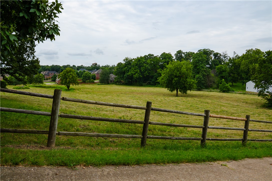 This 5.8-acre flat pasture offers a rare combination of true country quiet and immediate access to the best of Northwest Arkansas. Located only 3.1 miles from the Walmart AMP, 3.4 miles from Pinnacle Promenade, 3 miles from I-49, 5.5 miles from the Bentonville Square, and 8.5 miles from XNA Airport, the property puts you minutes from entertainment, shopping, major highways, and the airport while still delivering genuine rural privacy. The open, level ground and attractive surroundings make it equally suited for building a custom home, establishing a small hobby farm, or holding as an investment in one of Arkansas’s fastest-growing markets. You get the seclusion of acreage living without losing easy reach to restaurants, stores, schools, and local attractions. A hard-to-find opportunity for usable land this close to the heart of NWA.