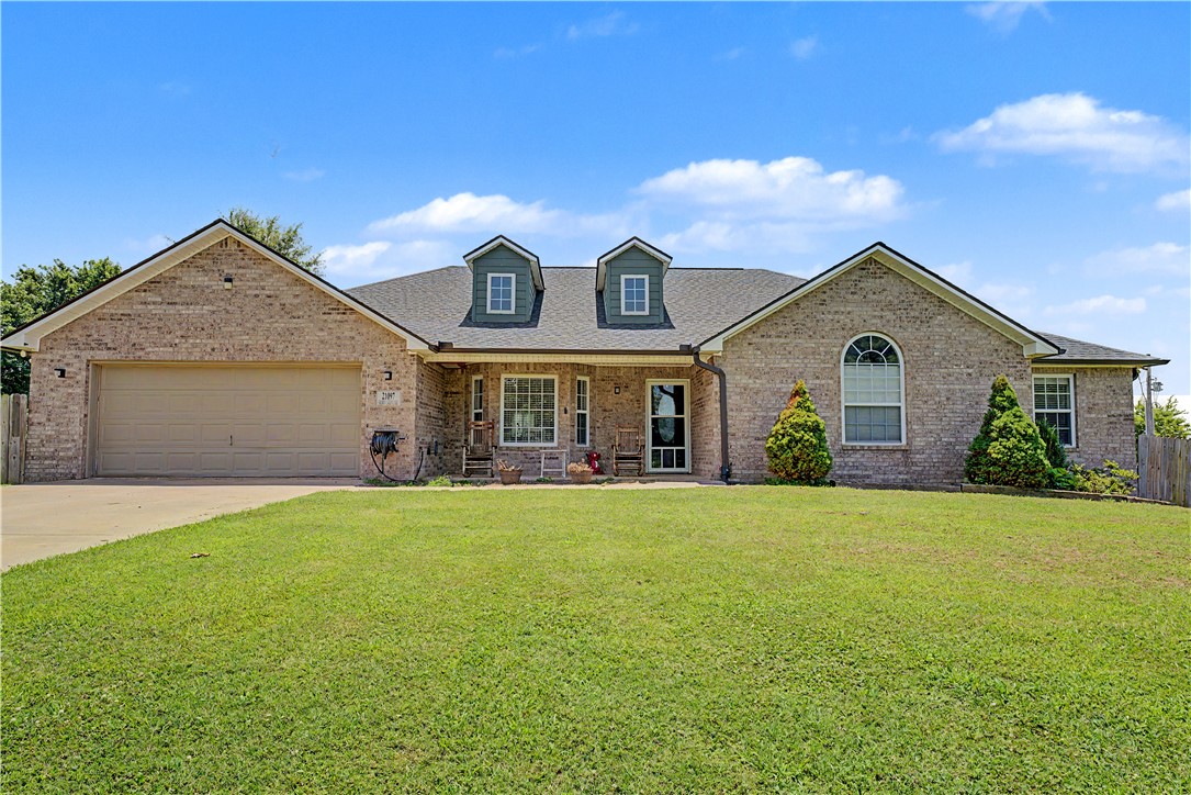 This beautiful brick home on an expansive 1.22 acre corner lot is located in an excellent spot just on the edge of town with lots of amenities. Mature trees, a backyard patio, an enclosed sunroom and vaulted ceilings bring the comforts of the outdoors and indoors together for your relaxation or to entertain. The home features a newly added bonus shop room as well as granite countertops and a large eat-in kitchen. Some photos were digitally enhanced.