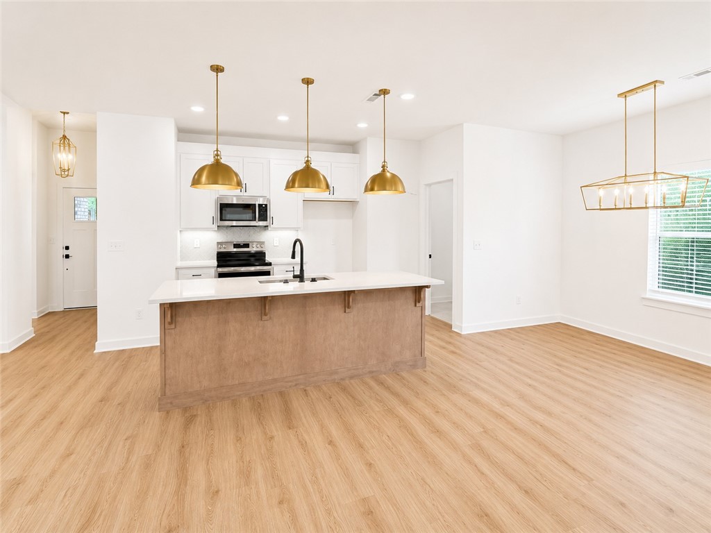 You’ll be just minutes away from some of Bella Vista’s best spots in this NEW home. Only 4 minutes to Scotsdale Golf Course, 6 minutes to Lakepoint Restaurant and Marina on Loch Lomond, 6 minutes to Branchwood Recreation Center and just 8 minutes from Highlands Golf Course and Pub, plus the Stoneykirk Boat Ramp. If your looking to hit the bike trails, your in luck! This lot is only 9 minutes to the thrilling Tunnel Vision and Bamboozled trails. Home's interior features a desirable open layout. Upgraded waterproof Coretec floating floors. Kitchen boasts large, thyme stained maple wood island, Quartz counters, stainless steel appliances, and a pantry. Living room fireplace. Dedicated laundry room with built in cabinets. Hot Water recirculation system. Fully tiled master shower. Big covered and extended deck with a great, *FLAT* yard!