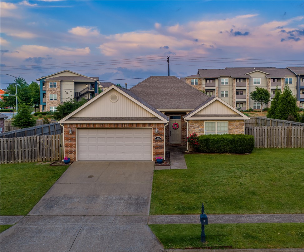 Fayetteville is having a moment and this address puts you right in the middle of it. This solid 4-bedroom, 2-bath brick home sits just 2.8 miles from the University of Arkansas campus, minutes from Wedington Drive’s shops and restaurants, and with quick access to I-49. Location like this doesn’t stay available long. This well maintained home offers 1,537 sq ft of smart, functional space, wood, tile, and carpet floors and a gas fireplace. The 2-car attached garage, keyless entry and wood privacy fencing check every practical box. Whether you’re planting roots or adding to a portfolio, this one makes sense. Four bedrooms, a proven neighborhood, and one of the fastest-growing cities in the South outside your front door.