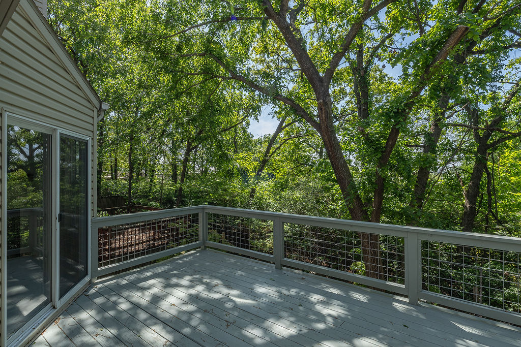 Move In Ready! Situated at College and Township, this 3-level, thoughtfully improved 3-bedroom, 2.5-bath condo offers a flexible layout for students, professionals, families, or guests. The location provides prime city access while remaining privately tucked away on a wooded hillside. Recent updates include a fully remodeled kitchen with a new island and a generously expanded deck designed for enjoying unmatched sunset views. 
The main level features the living room, kitchen, dining area, powder room, and access to the elevated deck. Upstairs includes the primary suite with full bath and walk-in closet, along with a second bedroom and walk-in closet. The walkout lower level offers a second primary bedroom and full bath, plus a family room, laundry area, and access to the covered ground-level deck.
This property is professionally landscaped for low-maintenance living and includes a fenced yard with direct stair access from the elevated deck. Walk to Starbucks and minutes from Gulley Park. Come see it today!